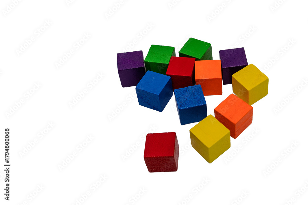 Obraz premium Colorful wooden toy cubes scattered on transparent background