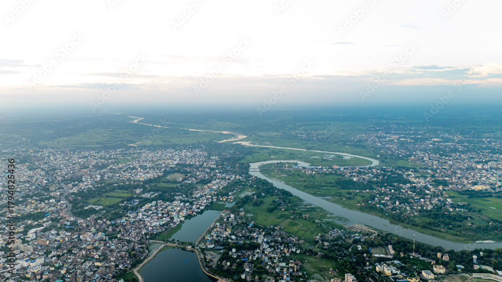 Obraz premium Top down Buildings and Apartment with Multiple Building aerial. Urban Buildings and Apartment at bridge road at Delhi. Cinematic cityscape drone shot. Noida Buildings.