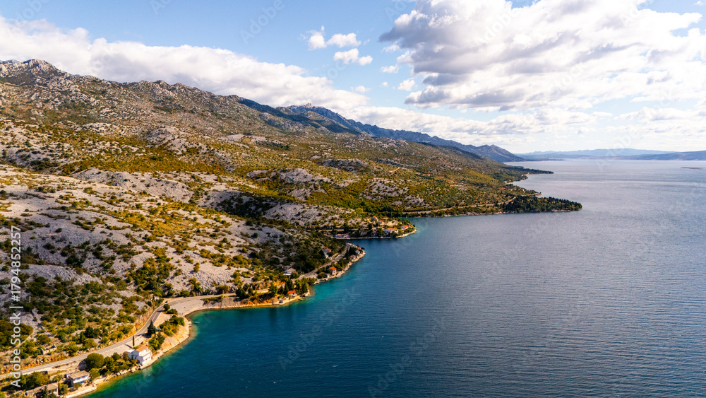 Fototapeta premium Aerial View of Croatia’s Scenic Coastal Road – Dramatic Adriatic Cliffs, Blue Sea and Mountain Landscape at One of the Most Beautiful Routes in Europe