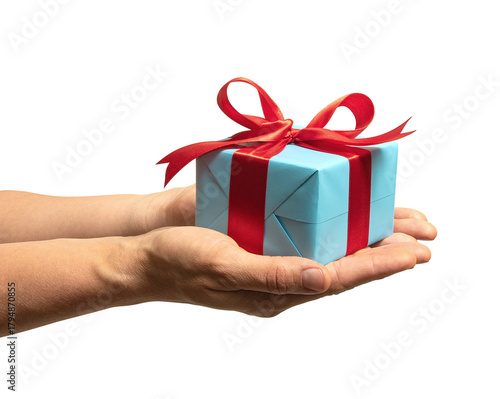 High quality PNG of close up hands with gift box is wrapped in light blue paper and tied with a red ribbon with a bow. Isolated image on a transparent background
