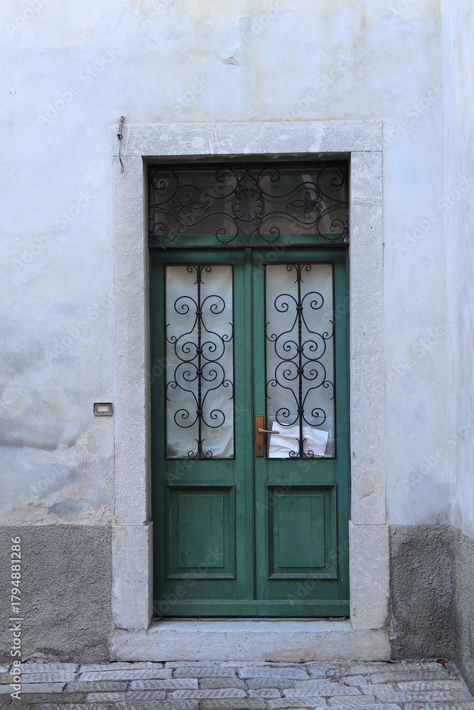 Fototapeta premium Green Vintage Door in Cividale del Friuli, Italy