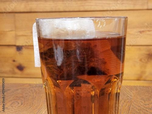 Tea. Black tea brewed in a glass. Hot brewed tea
