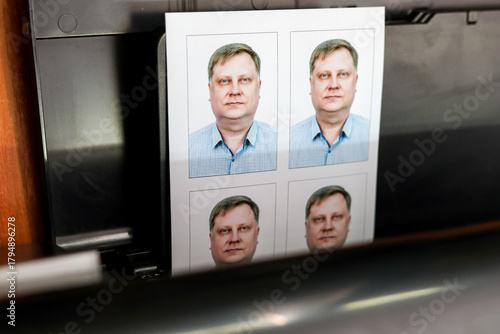 Printing documents on printer. Photo studio service - creating photos for passports, passes, and ID cards.