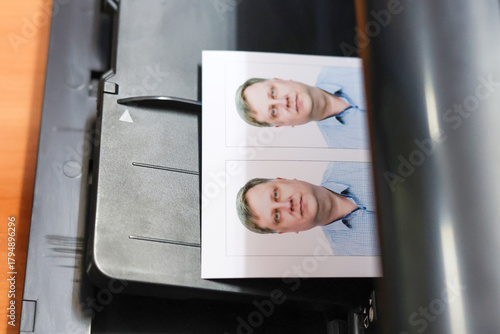 Printing documents on a printer. Photo studio service - creating photos passports, passes, and ID cards.