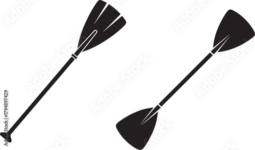 Two black silhouette paddles for kayaking or paddleboarding isolated on transparent background