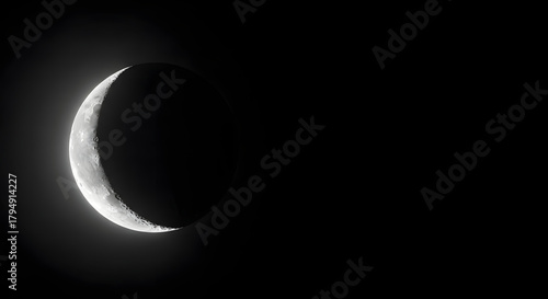 Crescent Moon in Night Sky with Dark Background and Starry Atmosphere