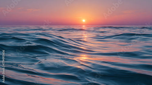 Fototapeta Naklejka Na Ścianę i Meble -  Brilliant Ocean View with Radiant Sunrise Colors and Rippling Water