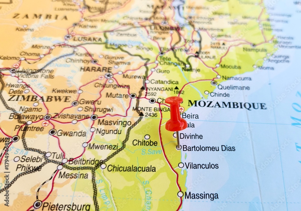 Fototapeta premium View of Bartolomeu Dias, city in located in the region of Inhambane Province, on a geographical map of Africa, marked with red pushpin