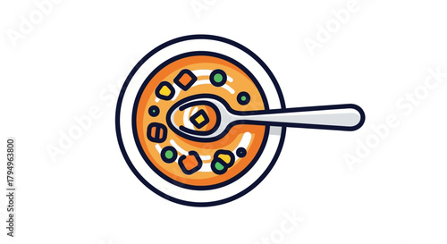 Bowl of soup with a spoon featuring carrots peas and other vegetables