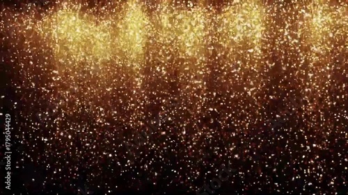 Golden falling glitter particles sparkle dust on black background for new year party event overlay