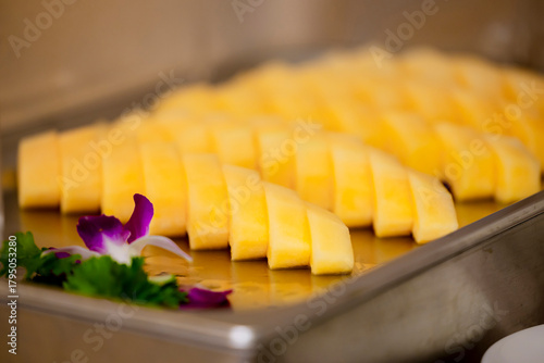 Принти на полотні Slices of cantaloupe are arranged evenly on a tray