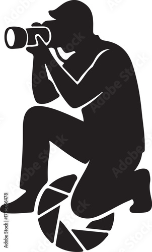 Photographer silhouette kneeling, capturing a moment with a camera and lens aperture