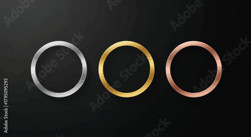 Elegant metallic rings on dark background gold, silver, bronze