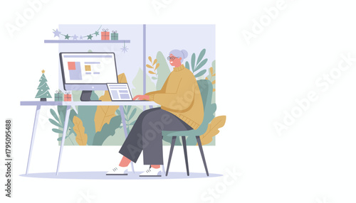 Senior woman working remotely on her computer in a festive Christmas home office setting