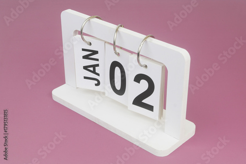 January, 2 on calendar on purple background.	