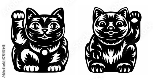 Two black maneki neko lucky cats inviting good fortune prosperity and wealth together