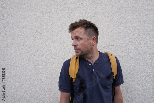 Portrait of a European Man by a Wall