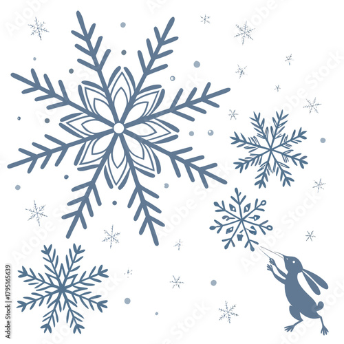 Cute rabbit reaching for a snowflake amidst a flurry of winter snow and ice crystals