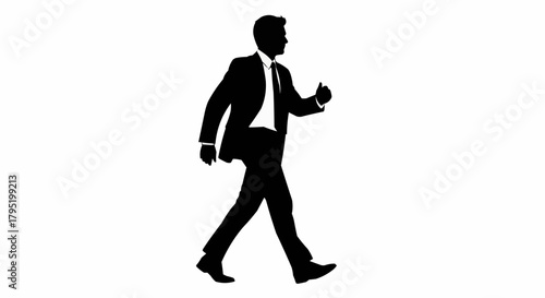 Silhouette of a businessman walking confidently in a suit.