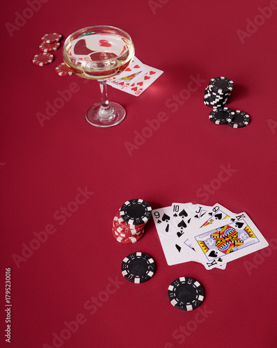 poker chips and cards on red table