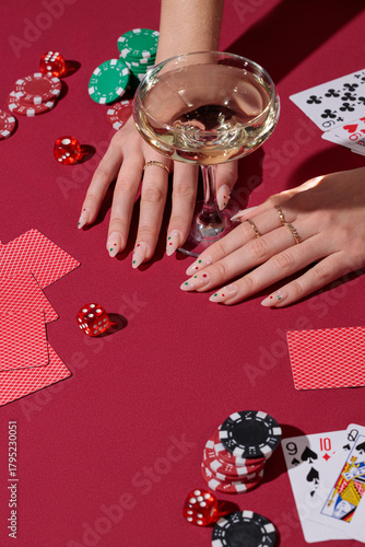 red poker table, hands playing cards, casino