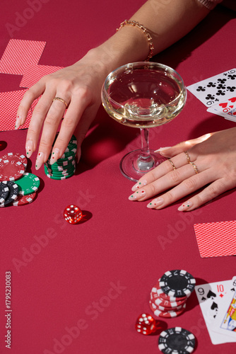 red poker table, hands playing cards, casino