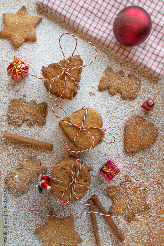 German speculoos cookies made with cookie cutters on decorated background