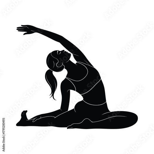 Silhouette of a woman performing a yoga pose with one leg extended