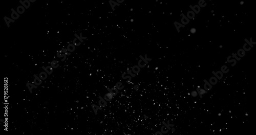 Falling snowflakes isolated on black background. Winter snow overlay texture for VFX, compositing, motion graphics and atmospheric effects