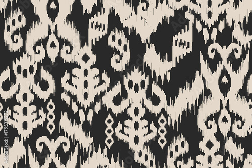 Seamless fabric motif patterns, abstract ikat patterns or abstract ethnic.Bold Black and Cream Tribal Ikat Seamless Pattern. ideal for textiles, fashion prints, wallpaper, home décor, wrapping paper