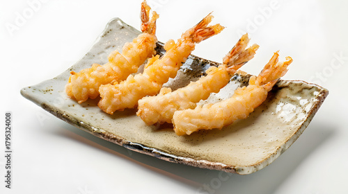 Minimalist food photography featuring four tempura shrimp placed diagonally. The texture of the ceramic plate is clearly visible. There are faint shadows in the blank area of the background. Cool whit