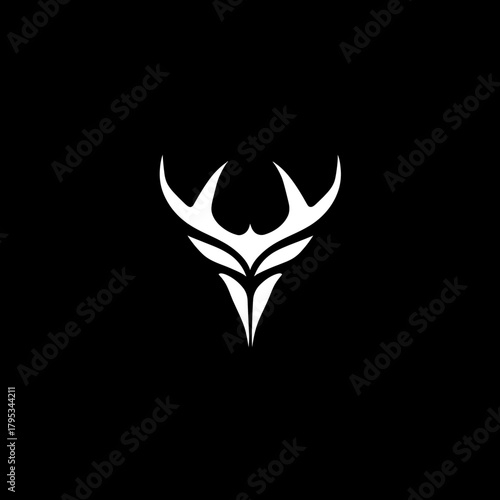 Abstract white deer head symbol against black background for design
