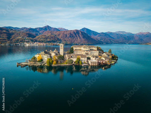Aerial view of the island of Orta San Giulio, in the middle of Orta Lake (Piedmont, Northern Italy). Is a glacial origin lake and its little island is an ancient home of a cloistered nuns.