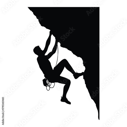 Silhouette of rock climber hanging on cliff