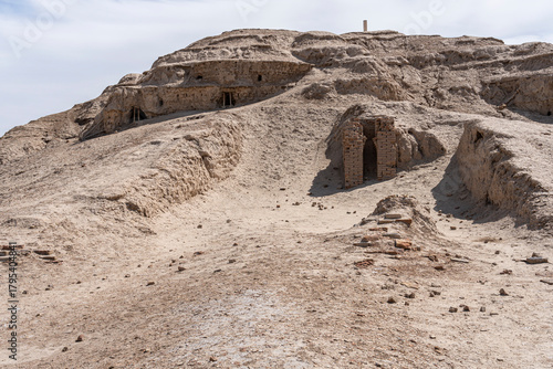 Ruins in Uruk, Iraq, display ancient brick structures amid arid landscapes