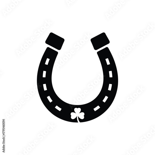 Black horseshoe with a clover symbol for good luck