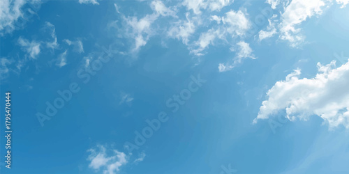 Bright blue sky with white, fluffy clouds and warm summer sunlight