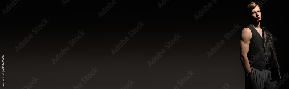 Naklejka premium Modern masculinity shines through a young mans confident pose in a stylish setting