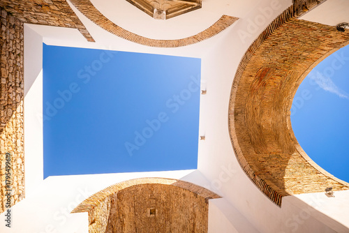 Arco do Repouso, a historic archway in Faro, Algarve, Portugal, showcasing traditional stone architecture