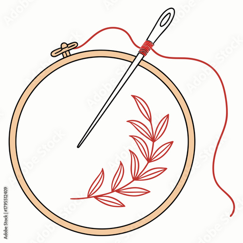 Embroidery hoop with needle and red thread creating a delicate red leaf branch design on white fabric
