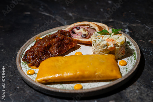 Venezuelan Christmas dish: hallaca, ham bread, chicken salad and pork leg