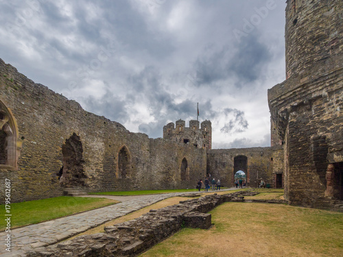 The ancient stone foundations of former buildings in the Outer Ward of a Welsh castle (Conwy, Wales, United Kingdom)