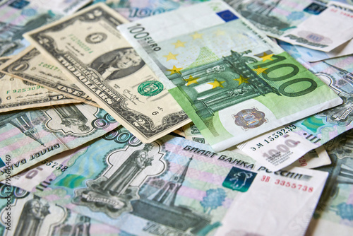 background of paper bills dollars, euros and rubles. Currency exchange rate
