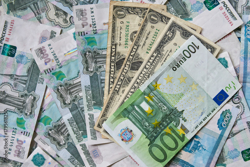 background of paper bills dollars, euros and rubles. Currency exchange rate