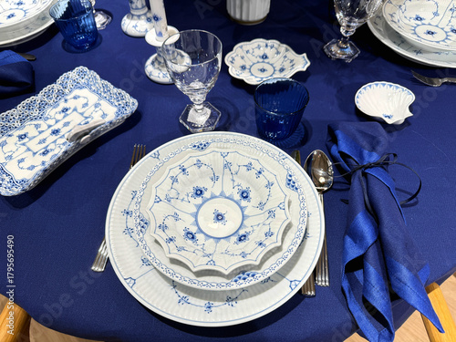 Photography Blue tablecloth with elegant festive dinner setting
