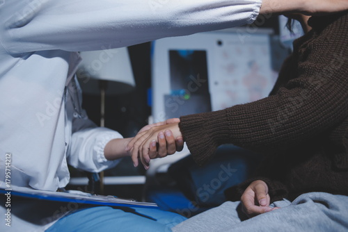 A female nurse caregiver holds hands to encourage and comfort an elderly woman. For care and trust in nursing homes for people of retirement age Caregiver helping elderly woman provides medical advice