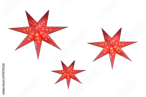 Three red Christmas stars decorated with small yellow stars, isolated on a white background