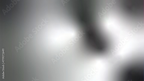 Heavily blurred grayscale photograph showing soft light gradients and an indistinct, out of focus subject