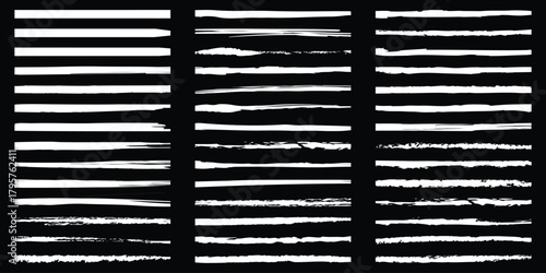Collection of distressed grunge horizontal brush strokes set on black background