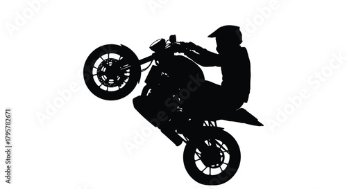 Motorcycle rider performing wheelie stunt action